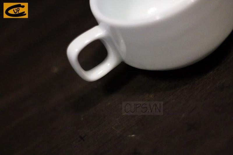 The handle of the cup has a simple square design